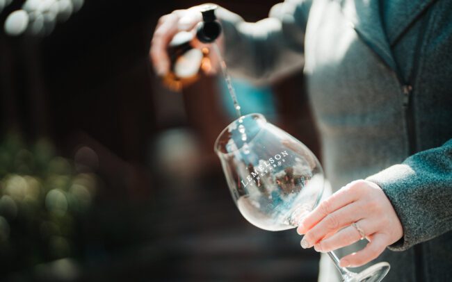 Pouring wine into a glass for tasting
