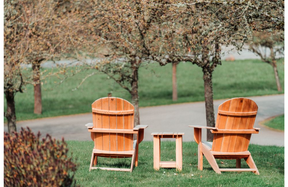 Wooden adirondack chairs and table